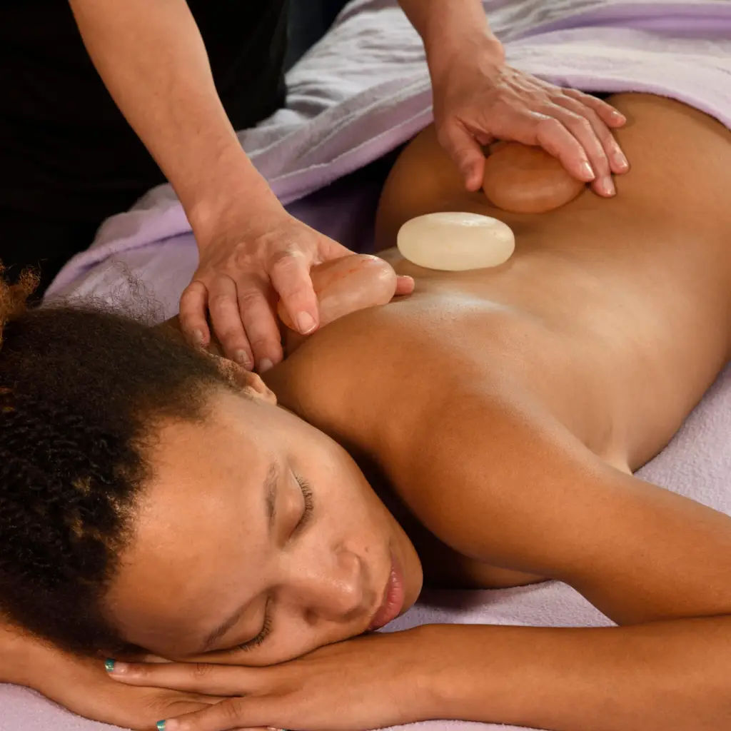 woman receiving salt stone massage